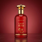 Red perfume bottle labeled 'Last Bliss' with gold accents on a red background