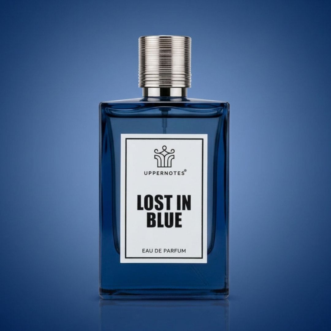 Blue perfume bottle labeled 'Lost in Blue' by Uppernotes on a blue background