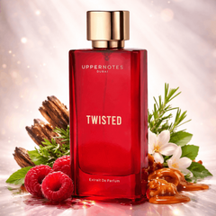 Red perfume bottle labeled 'Twisted' with decorative elements on a reflective surface.