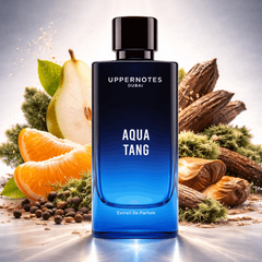 Blue perfume bottle labeled 'Aqua Tang' by Uppernotes Dubai with natural elements in the background.