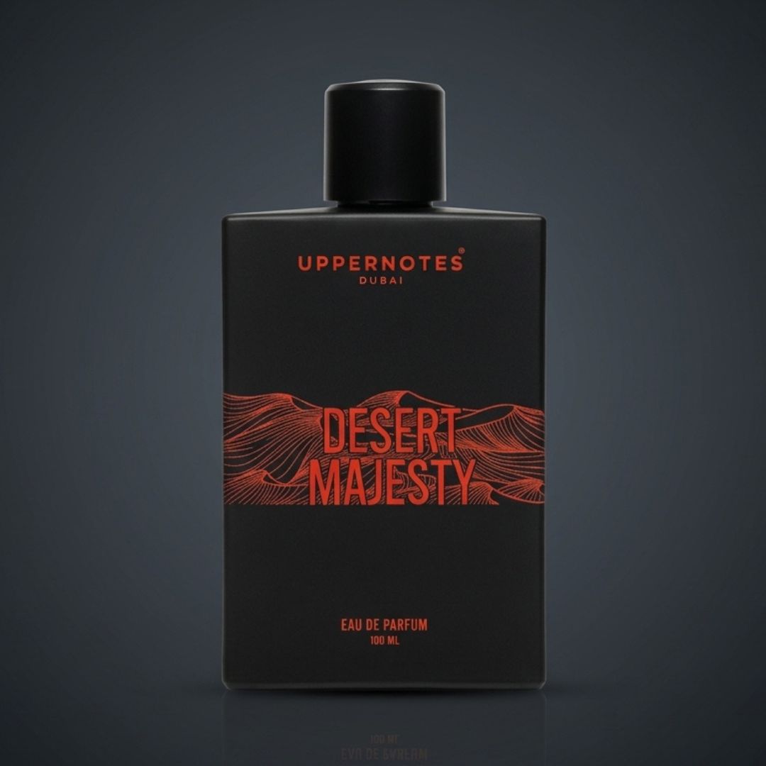 Black perfume bottle labeled 'Desert Majesty' by Uppernotes on a dark background