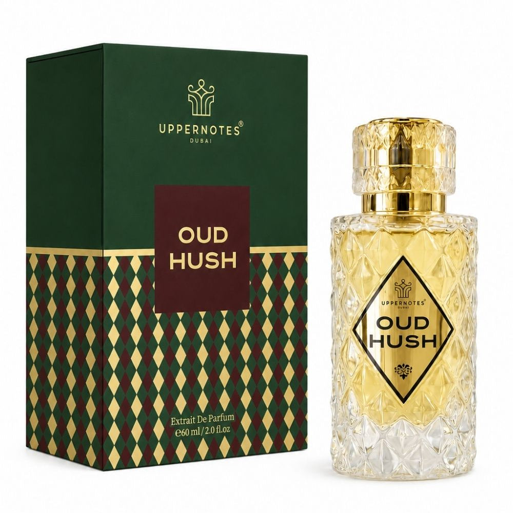 Uppernotes Oud Hush perfume bottle and its packaging box. The bottle is made of clear textured glass with a shiny gold cap and a gold diamond-patterned label.