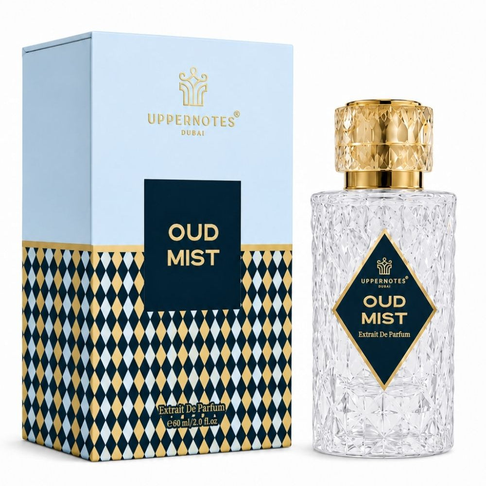 A bottle of Uppernote's Oud Mist perfume next to its packaging box. The bottle is made of textured clear glass with a shiny gold cap and a black and gold diamond-shaped label.